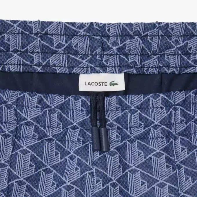 Damska spodnie dresowe z rozkloszowanymi nogawkami i monogramem Damska spodnie dresowe z rozkloszowanymi nogawkami i monogramem