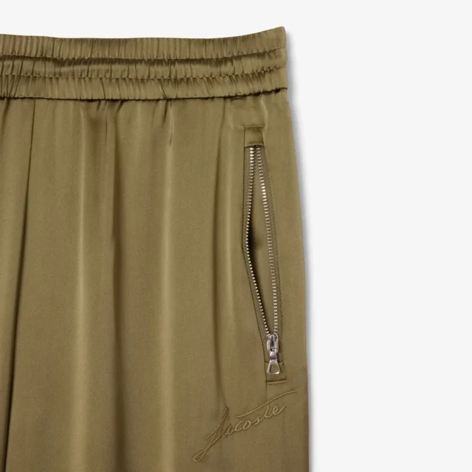 Damskie oversize’owe satynowe spodnie dresowe Damskie oversize’owe satynowe spodnie dresowe