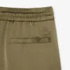 Damskie oversize’owe satynowe spodnie dresowe Damskie oversize’owe satynowe spodnie dresowe