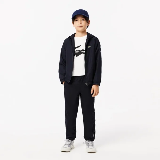 Dziecięcy T-shirt tenisowy z bawełny technicznej w stylu oversize Dziecięcy T-shirt tenisowy z bawełny technicznej w stylu oversize