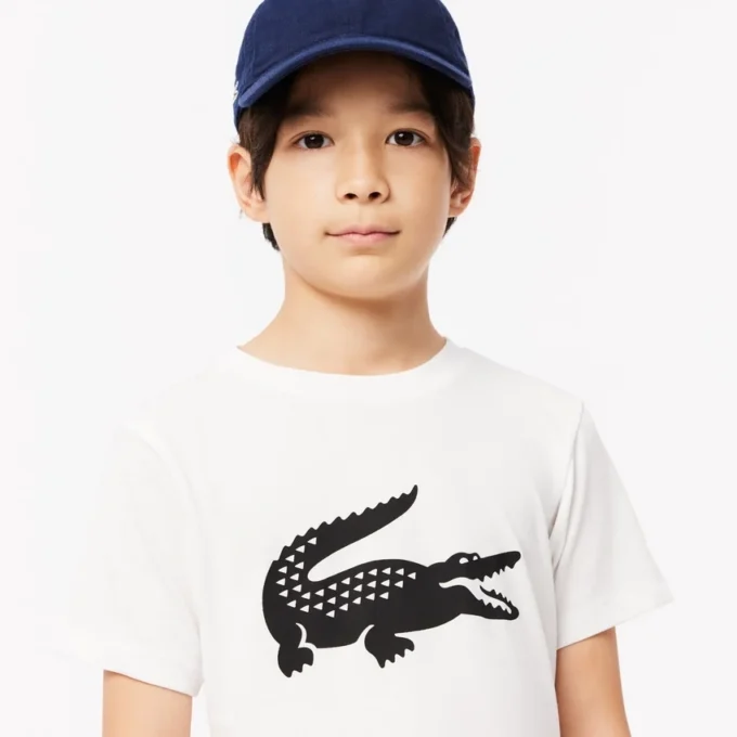 Dziecięcy T-shirt tenisowy z bawełny technicznej w stylu oversize Dziecięcy T-shirt tenisowy z bawełny technicznej w stylu oversize