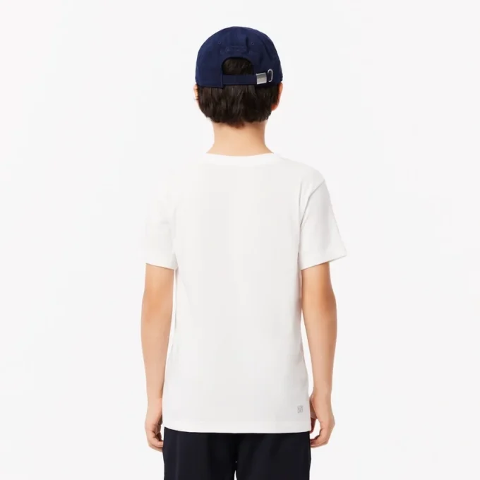 Dziecięcy T-shirt tenisowy z bawełny technicznej w stylu oversize Dziecięcy T-shirt tenisowy z bawełny technicznej w stylu oversize