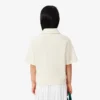 Dziewczęca koszulka Polo oversize z dzianiny piqué Dziewczęca koszulka Polo oversize z dzianiny piqué