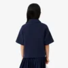 Dziewczęca koszulka Polo oversize z dzianiny piqué Dziewczęca koszulka Polo oversize z dzianiny piqué