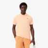 Koszulka polo Lacoste Tennis X Novak Djokovic na kort Koszulka polo Lacoste Tennis X Novak Djokovic na kort