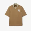 Koszulka Polo oversize z satyny z naszywką z wybiegu Koszulka Polo oversize z satyny z naszywką z wybiegu