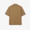 Koszulka Polo oversize z satyny z naszywką z wybiegu Koszulka Polo oversize z satyny z naszywką z wybiegu