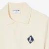 Sweter z kołnierzem Polo i naszywką „Made in France”