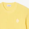 Sweter z naszywką z dzianiny ściągaczowej w kolorze perłowym